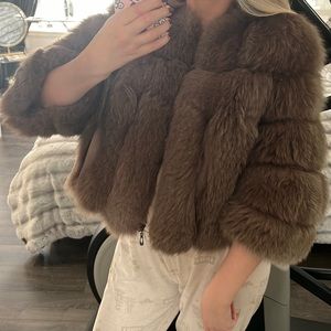 Beautiful short coat made of arctic fox fur, natural